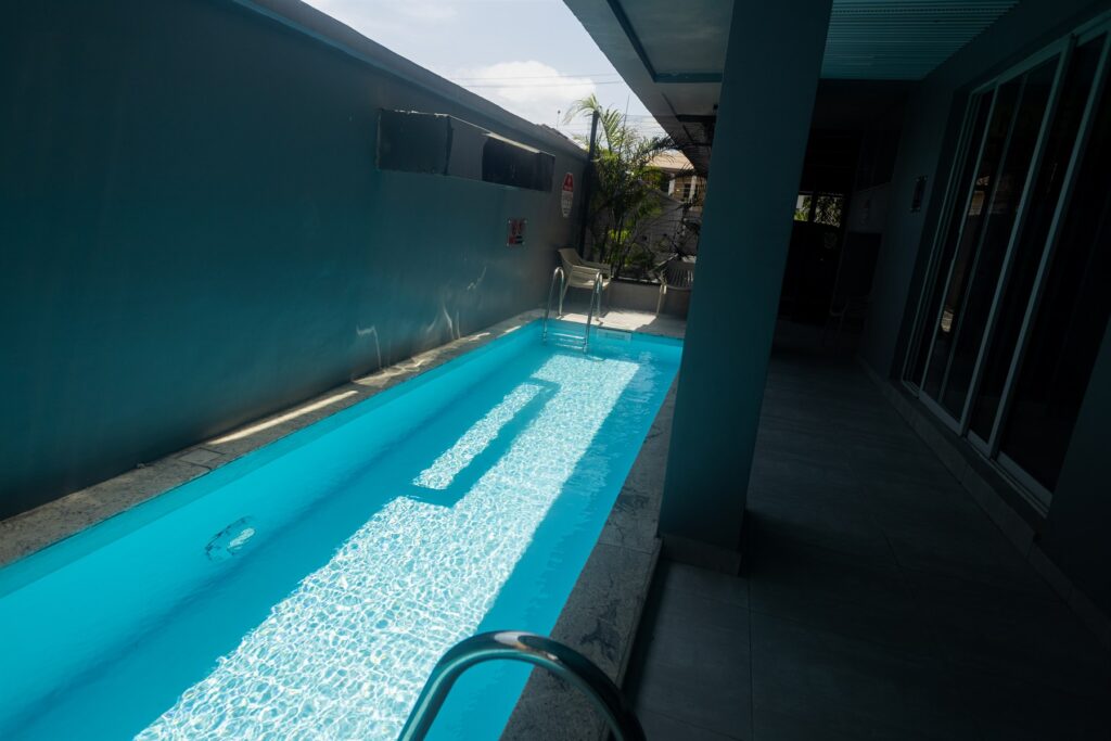 Brum Height 6: Long narrow swimming pool beside the residential building